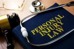 photo of a personal injury law book with a stethoscope and gavel