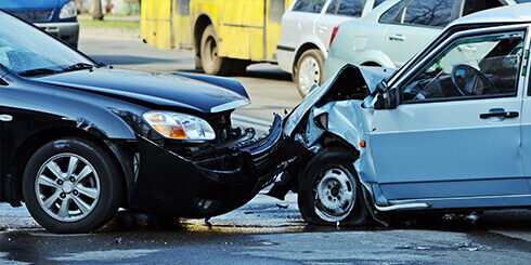 Photo of two cars after a head one collision in the middle of the road
